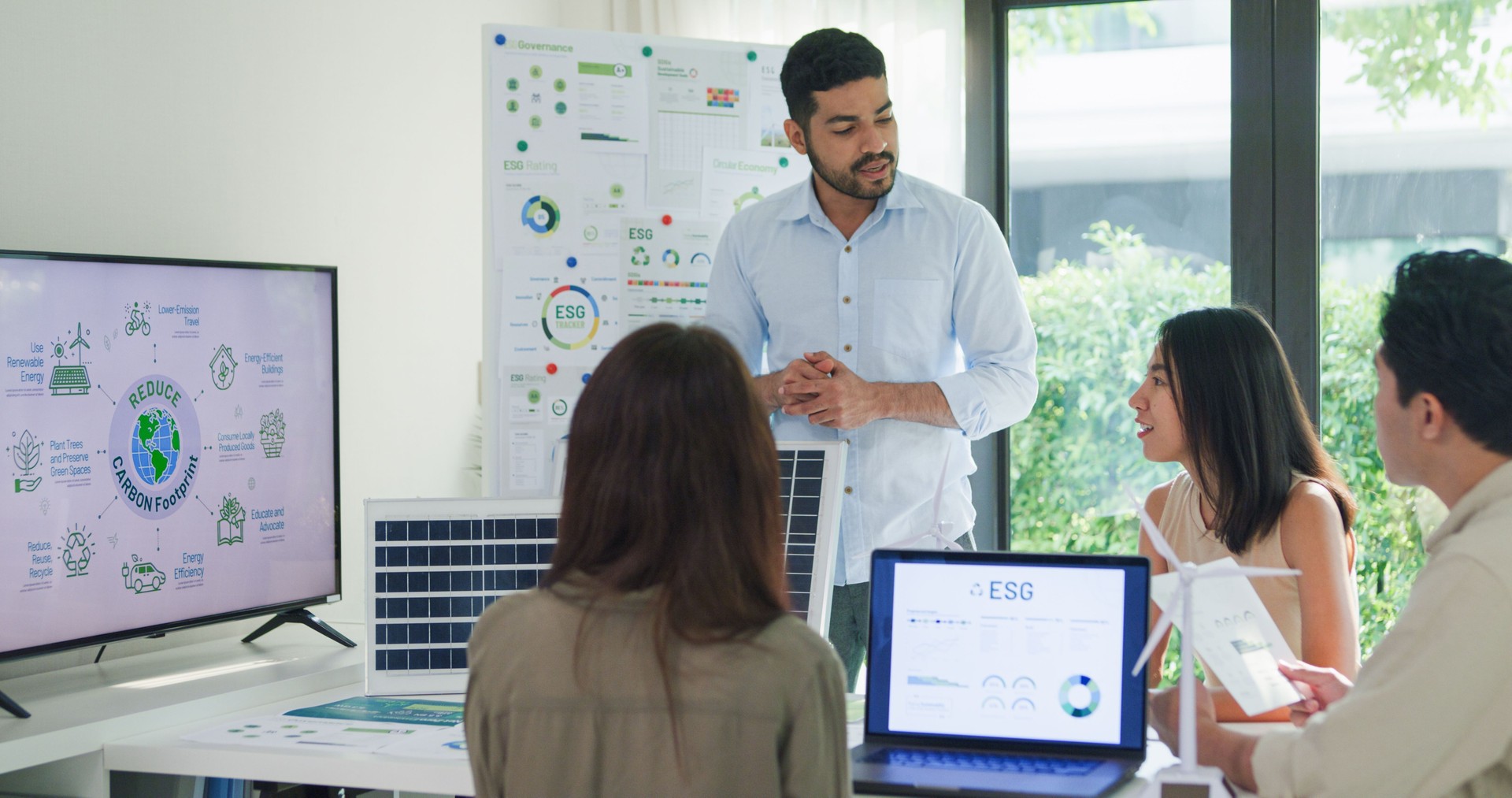 Group Asia businesspeople talk ESG strategies risk management workshop, SDGs report, global warming, green finance and investment and net zero waste lifestyles in boardroom training building.